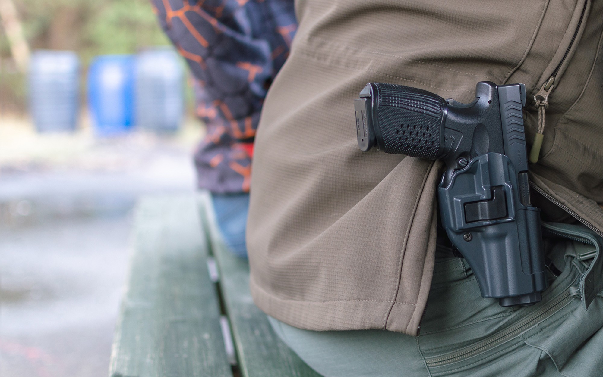 Wisconsin man with pistol in hip holster displaying legal open carry rights in public